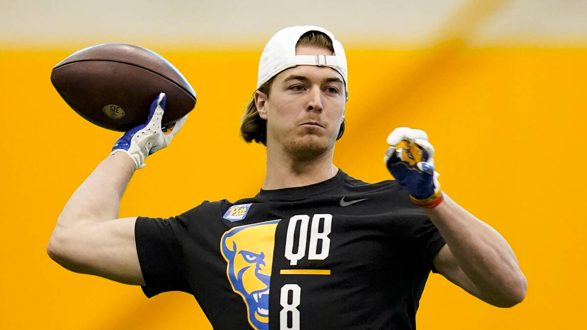 Pittsburgh quarterback Kenny Pickett (8) performs drills during Pittsburgh's football pro day , ...