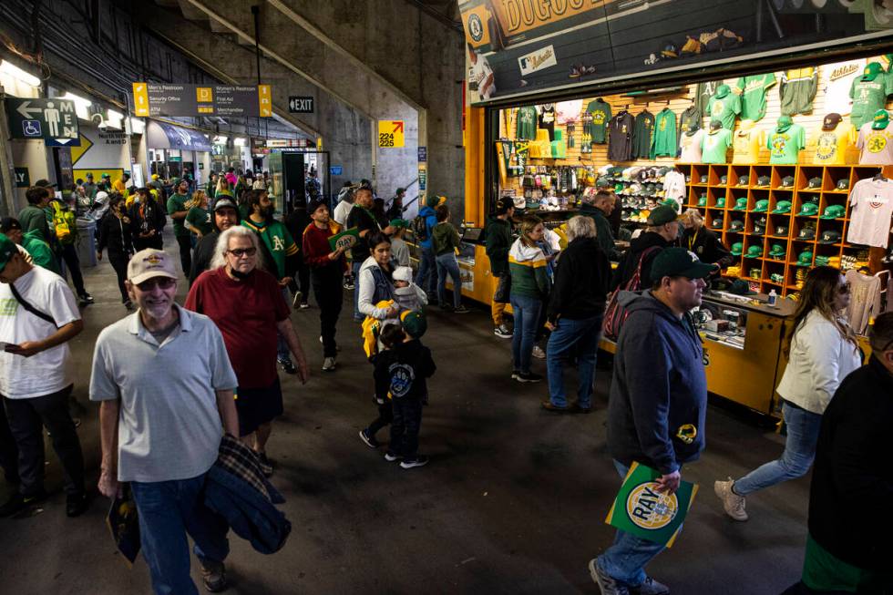 Oakland Athletics fans walk the concourse before the opening night game against the Baltimore O ...