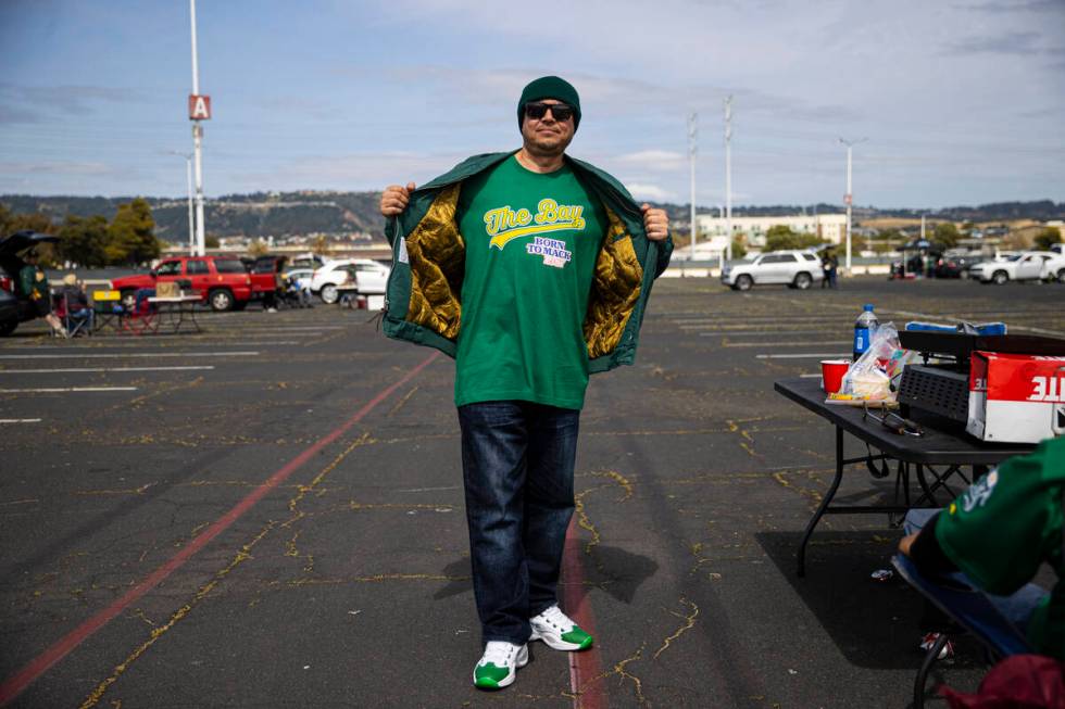 Mario Cruz, of Modesto, Calif., poses for a picture before the opening night game against the B ...