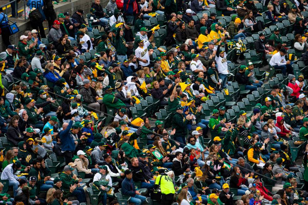 Oakland Athletics fans watch the opening night game against the Baltimore Orioles on Monday, Ap ...