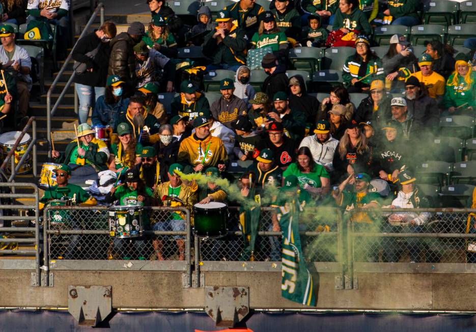 Oakland Athletics fans watch the opening night game against the Baltimore Orioles on Monday, Ap ...