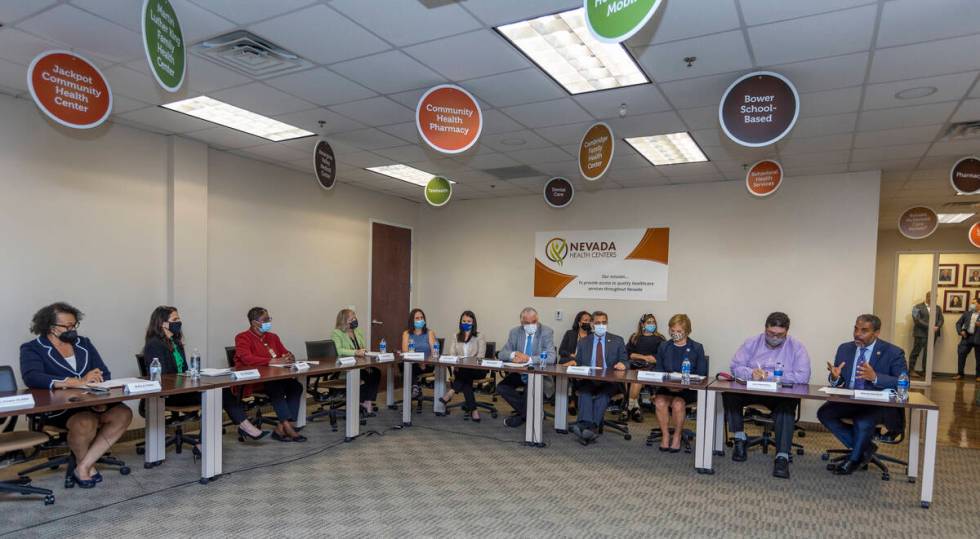 Rep. Steven Horsford, right, speaks at a cancer panel discussion with other guests, including H ...