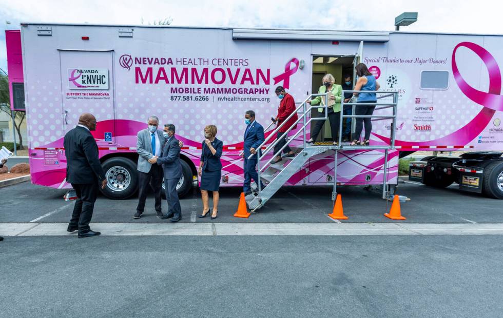 Guests gather after touring the Nevada Health Center's Mammovan as HHS Secretary Xavier Becerra ...