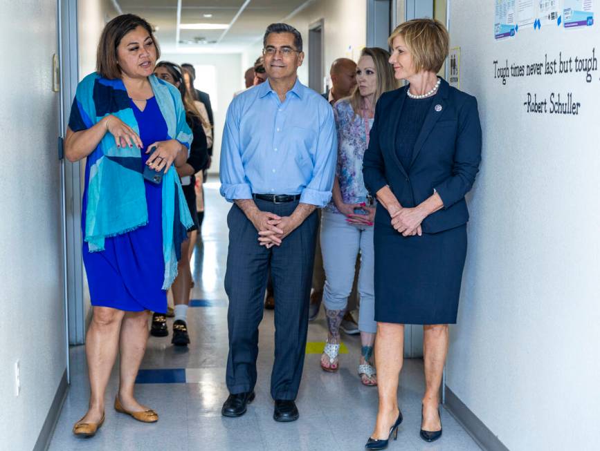 From left, Fuiala Riley, President and CEO HELP of Southern Nevada, gives a tour to HHS Secreta ...