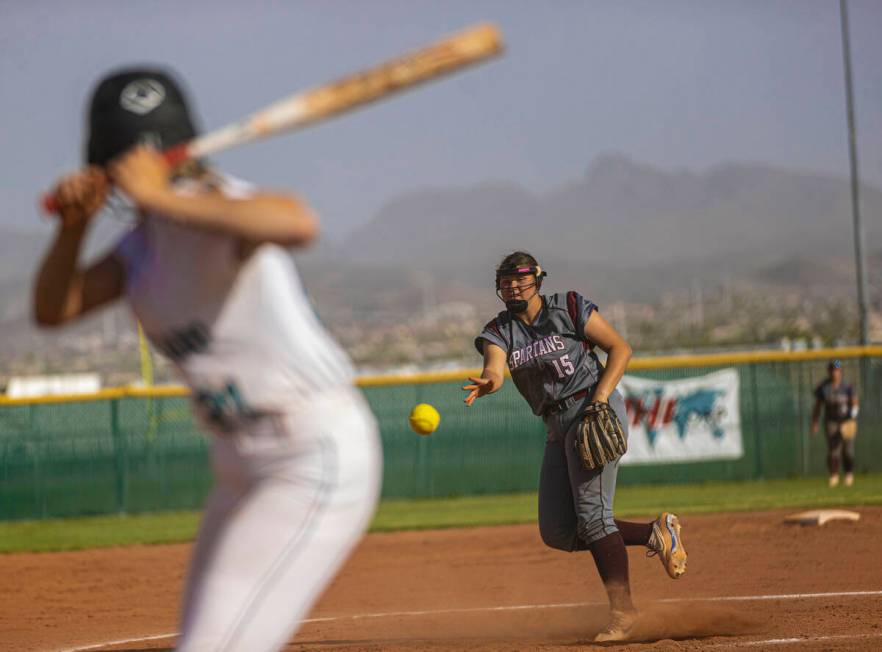 Cimarron-Memorial’s Makenna Webber (15) pitches during a girls high school softball game ...