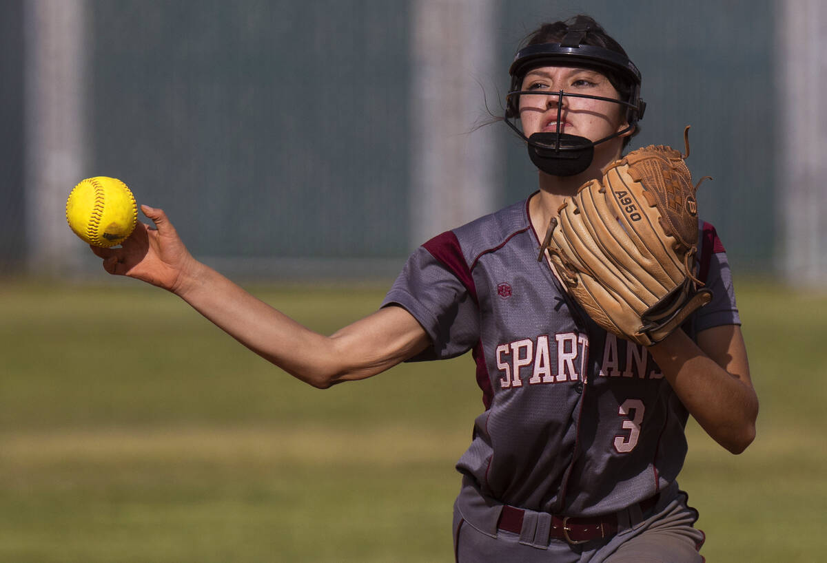 Cimarron-Memorial’s Mariana Ponce (3) makes a throw to first base during a girls high sc ...