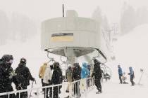 Skiers line up at the Canyon Express high speed chairlift in Mammoth Mountain in Mammoth Lakes, ...