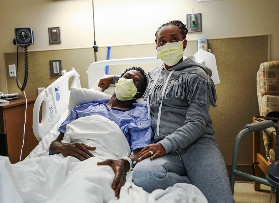 Derek McMillan, left, with his wife Darshelle McMillan, right, speak to the Review-Journal abou ...