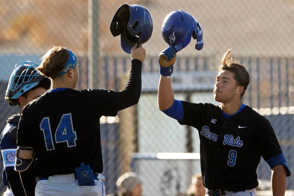 Sierra Vista’s J.T. Starkus (9) celebrates with teammate Mikey Clark (14) after hitting ...