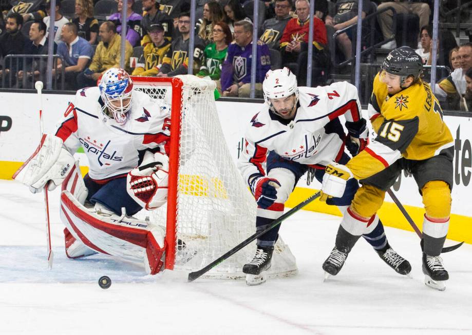 Golden Knights center Jake Leschyshyn (15) shoots on Washington Capitals goaltender Ilya Samson ...