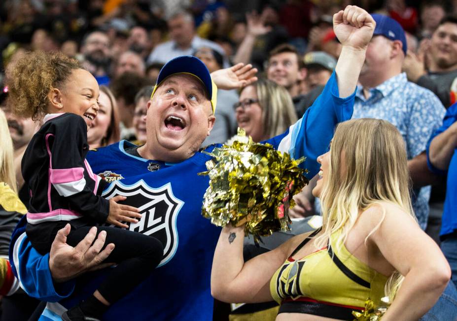 Golden Knights fans cheer for Vegas during an NHL hockey game against the Washington Capitals o ...