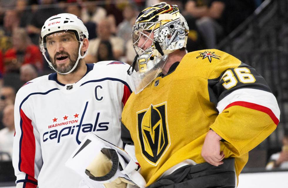 Golden Knights goaltender Logan Thompson (36) talks with Washington Capitals left wing Alex Ove ...