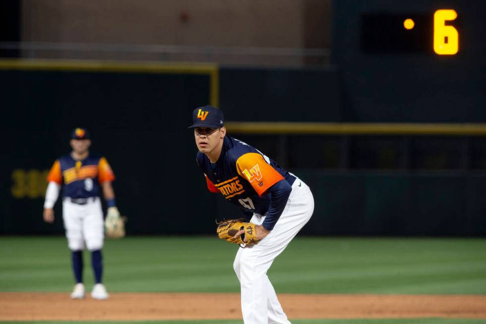 Las Vegas Aviators pitcher Luis Martinez (47) eyes the catcher while the pitch clock is at 6 se ...
