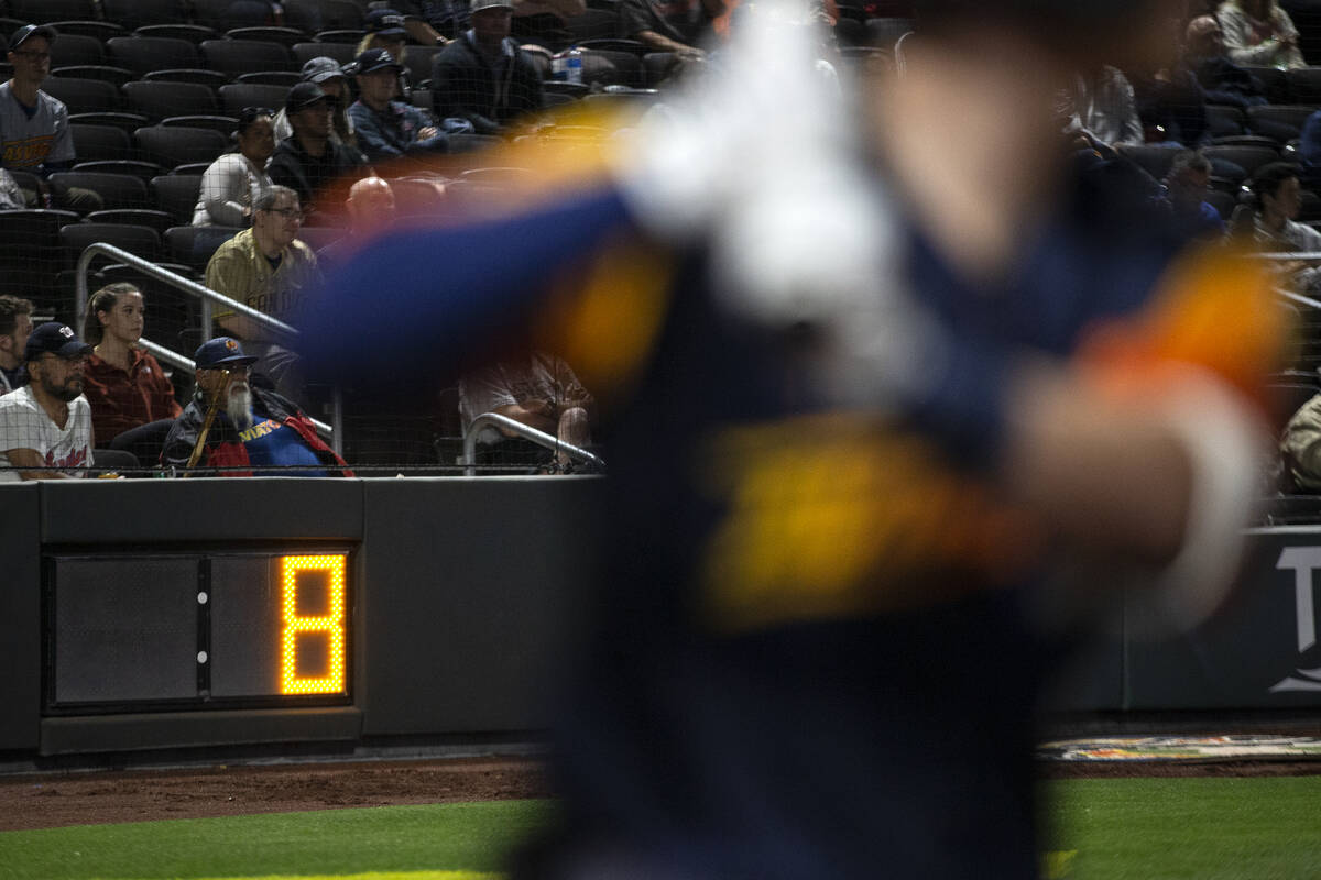A batter warms up as the pitch clock is at 8 seconds during a Minor League Baseball game betwee ...