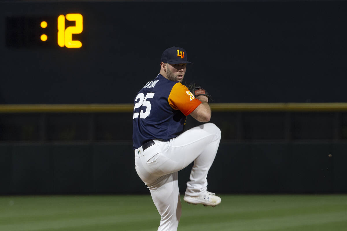 Las Vegas Aviators pitcher Aaron Brown (12) throws to the El Paso Chihuahuas while the pitch cl ...