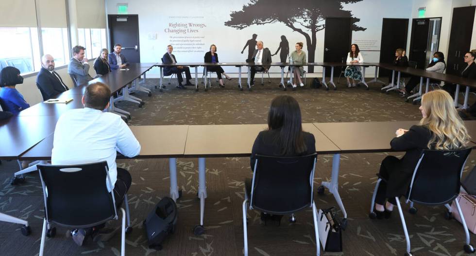 Nevada Gov. Steve Sisolak, rear center, during a roundtable discussion at the Legal Aid Center ...