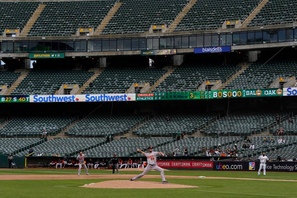 Baltimore Orioles' Jordan Lyles pitches against the Oakland Athletics during the third inning o ...