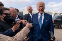 President Joe Biden speaks to the media before boarding Air Force One at Des Moines Internation ...