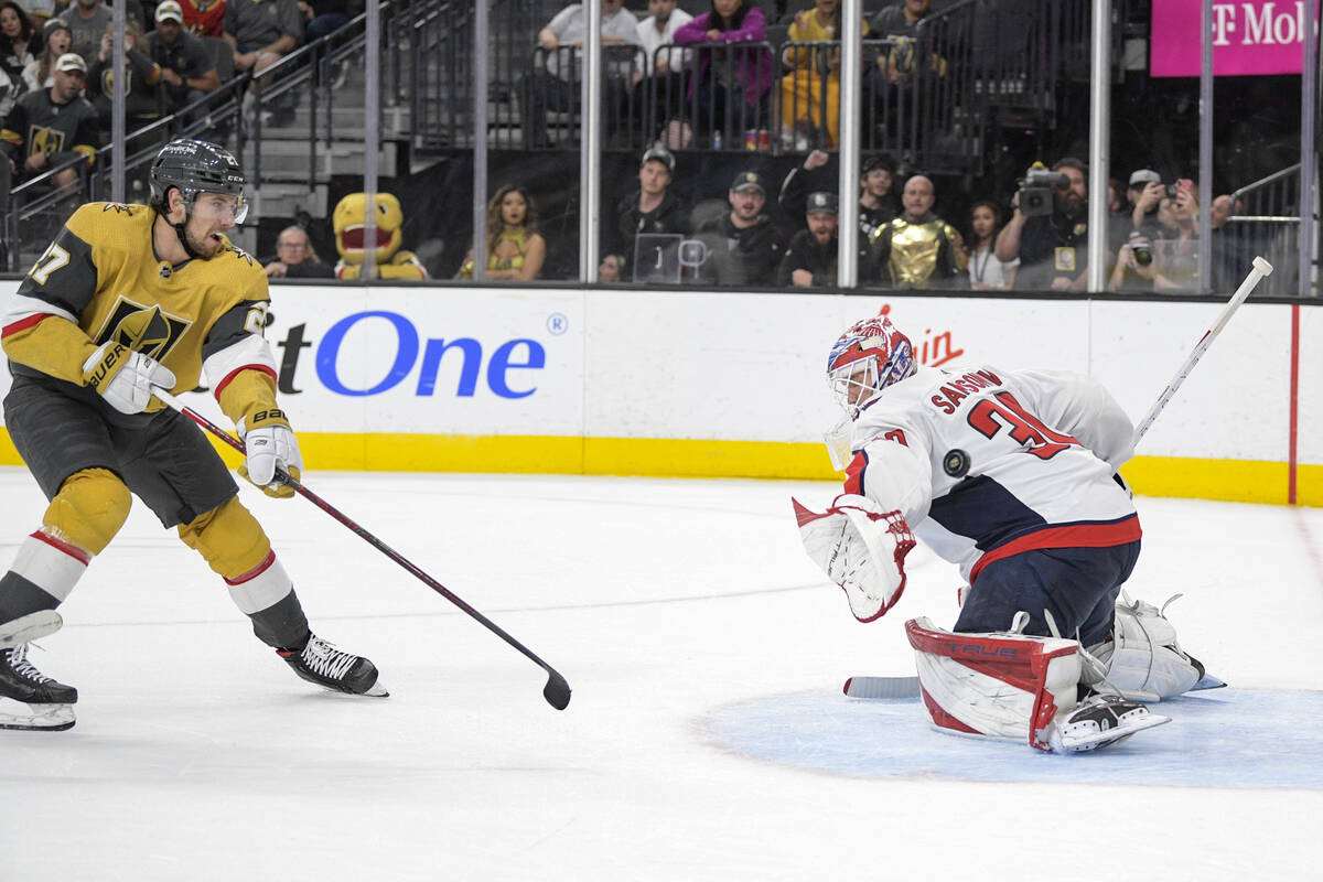 Vegas Golden Knights defenseman Shea Theodore (27) scores against Washington Capitals goaltende ...