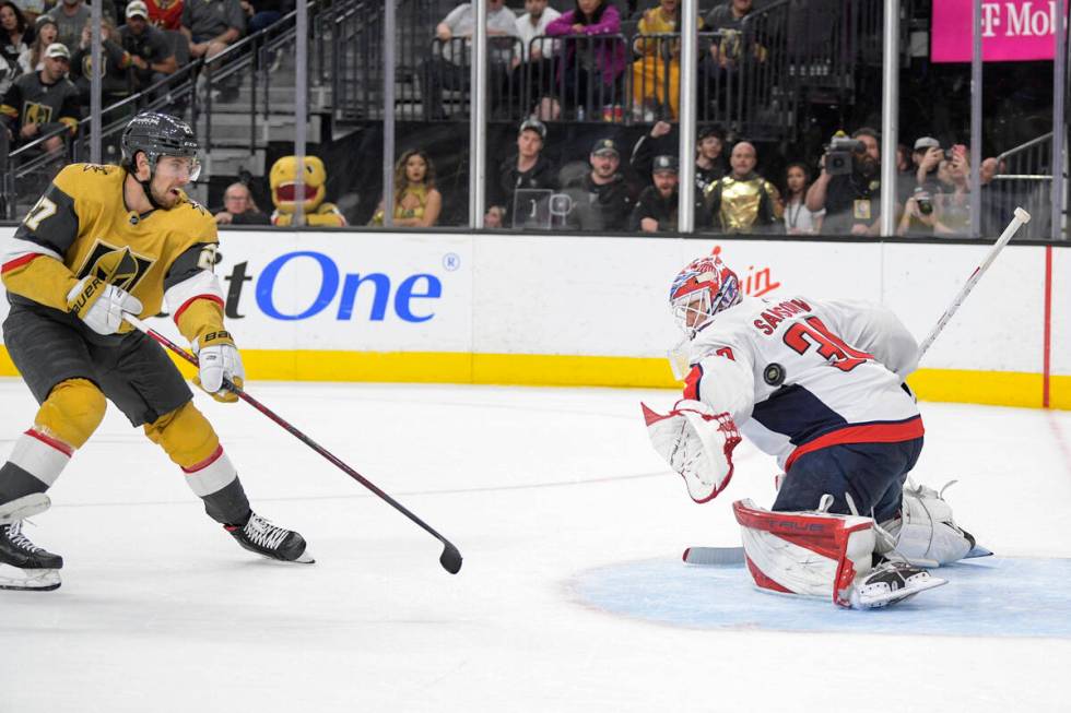 Vegas Golden Knights defenseman Shea Theodore (27) scores against Washington Capitals goaltende ...