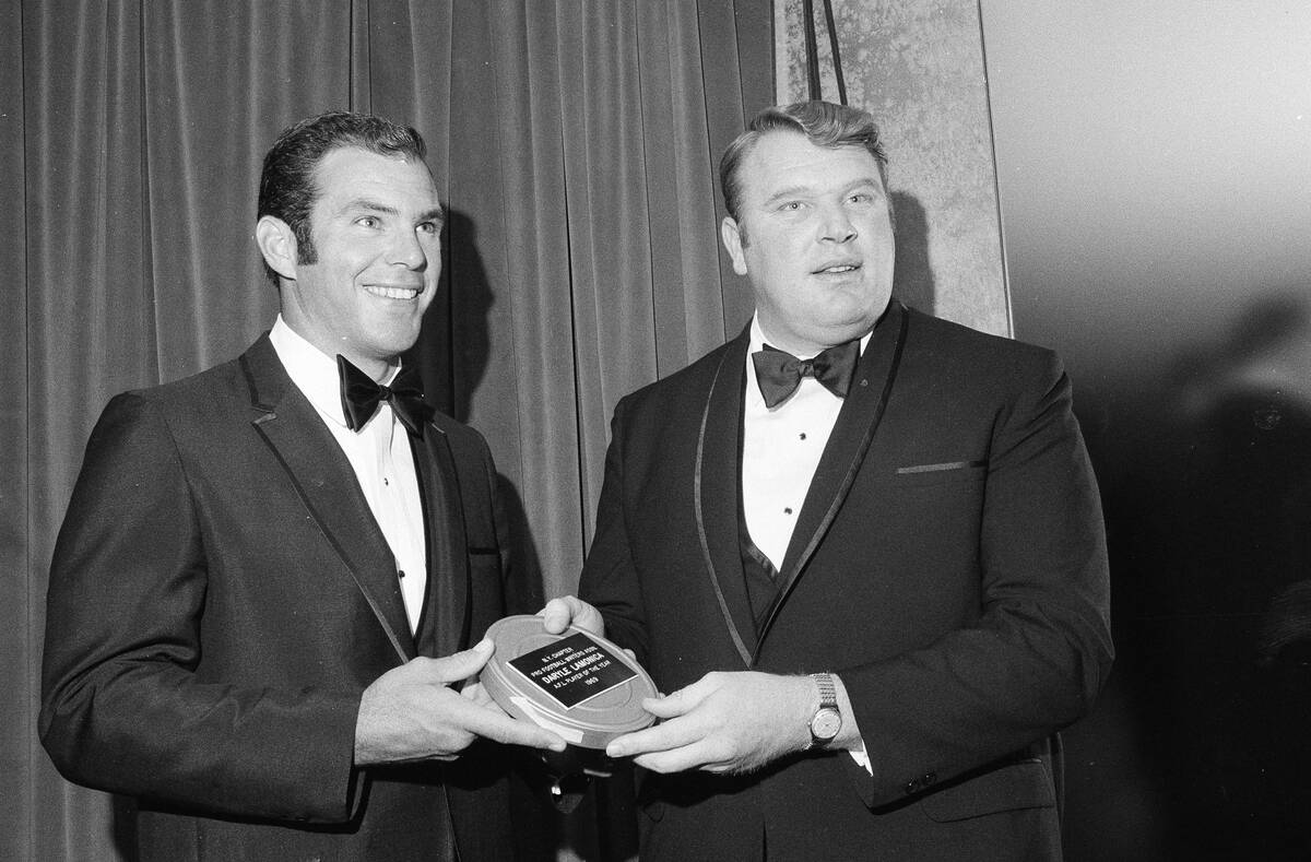 FILE - Daryle Lamonica, left, named AFL Player of the Year by the New York Charter of the Profe ...