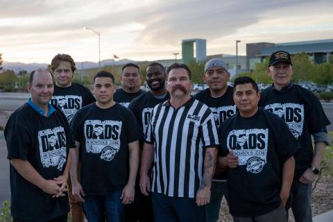 Pastor Troy Martinez, fourth from right, poses for a portrait with a group of CCSD fathers afte ...