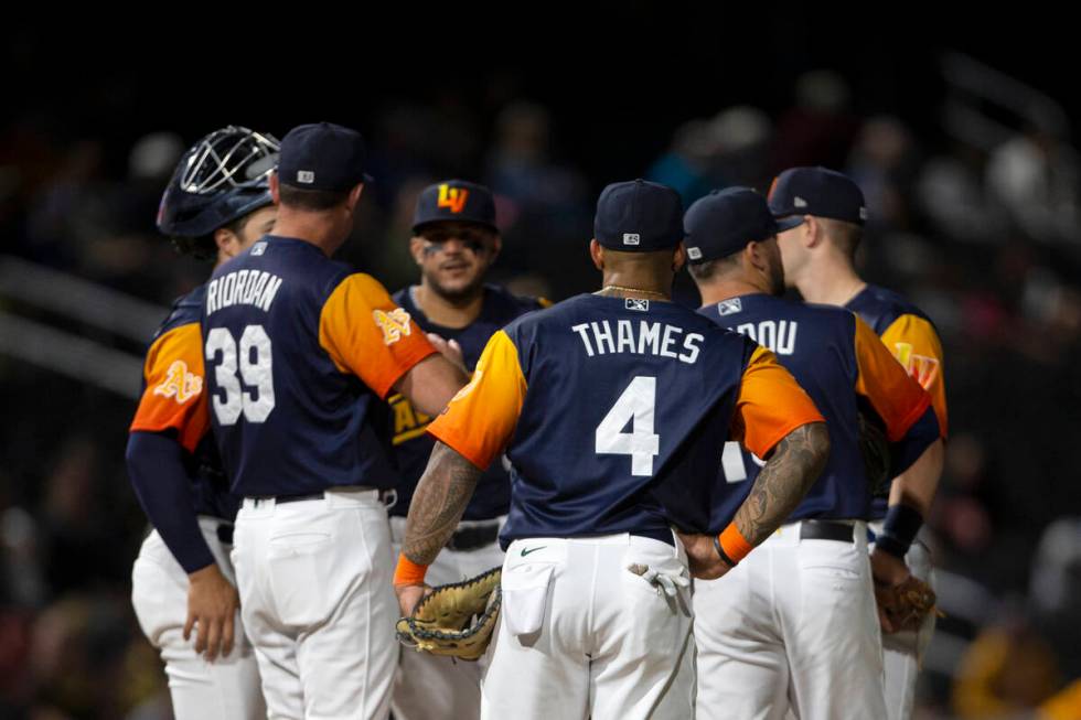 Las Vegas Aviators first baseman Eric Thames (4) participates in a huddle at the pitcher&#x2019 ...