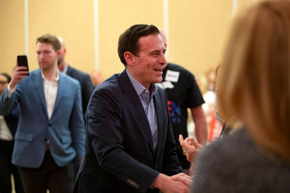 Nevada Republican U.S. Senate candidate Adam Laxalt shakes the hands of attendees during a rall ...