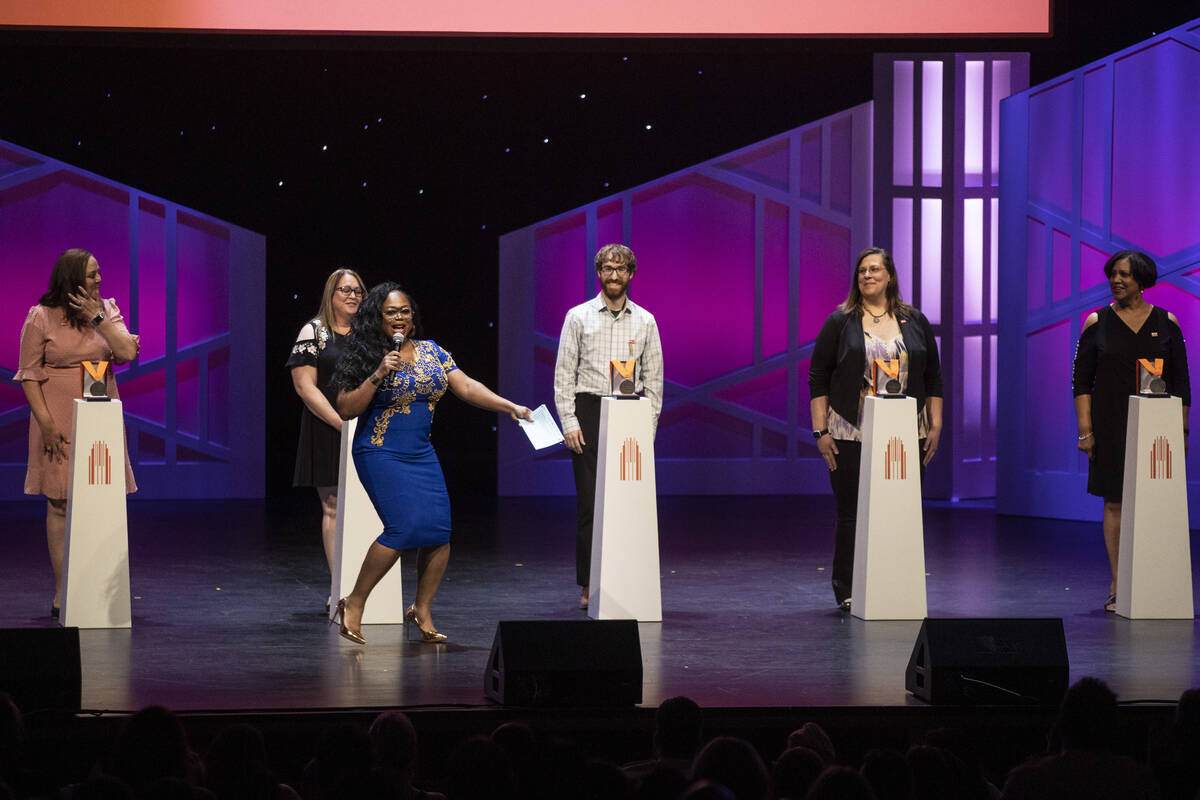 Emcee Monica Jackson, third from left, introduces teachers and winners during the Heart of Educ ...