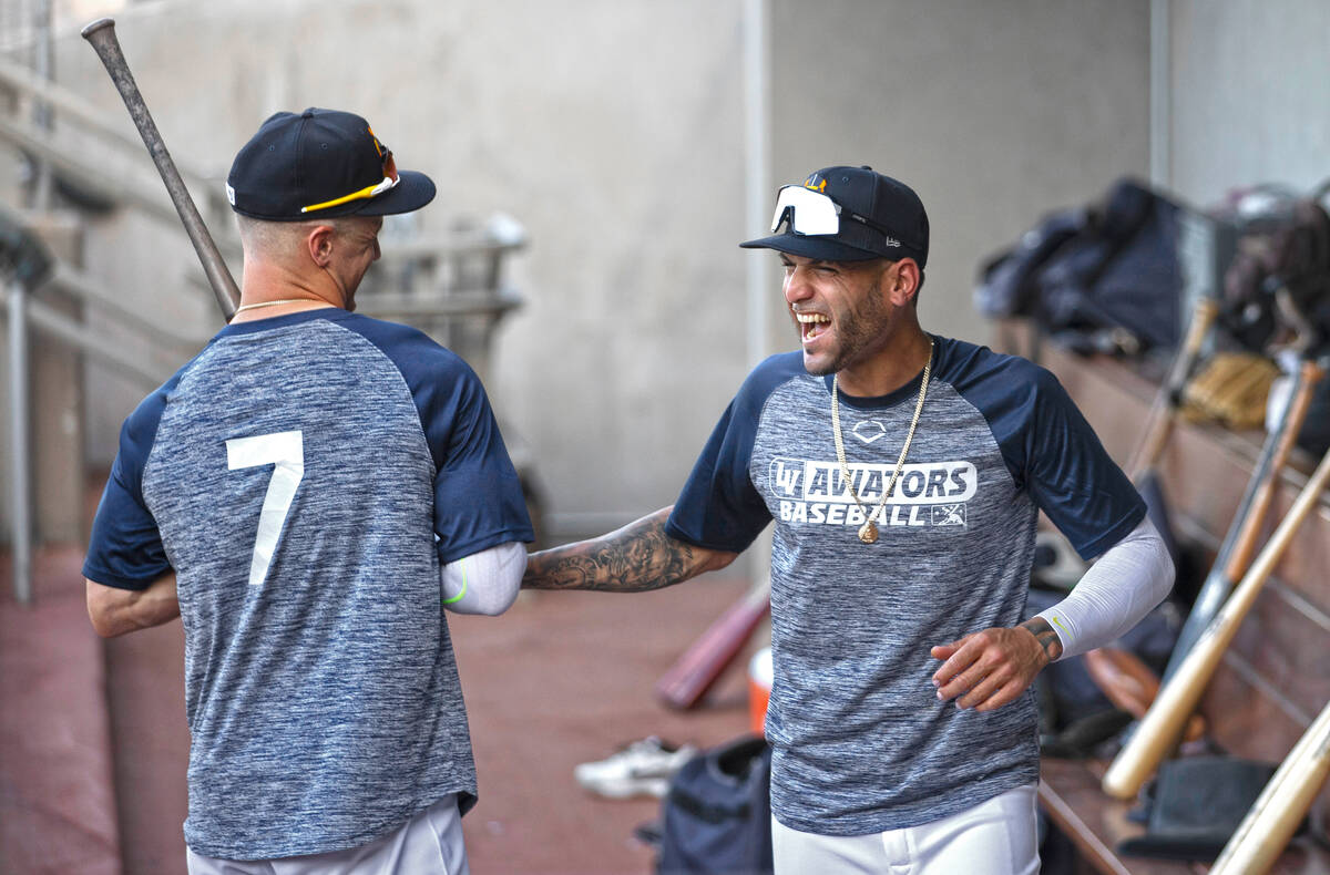 In this May 4, 2021, file photo, Aviators outfielder Luis Barrera, right, jokes around with tea ...