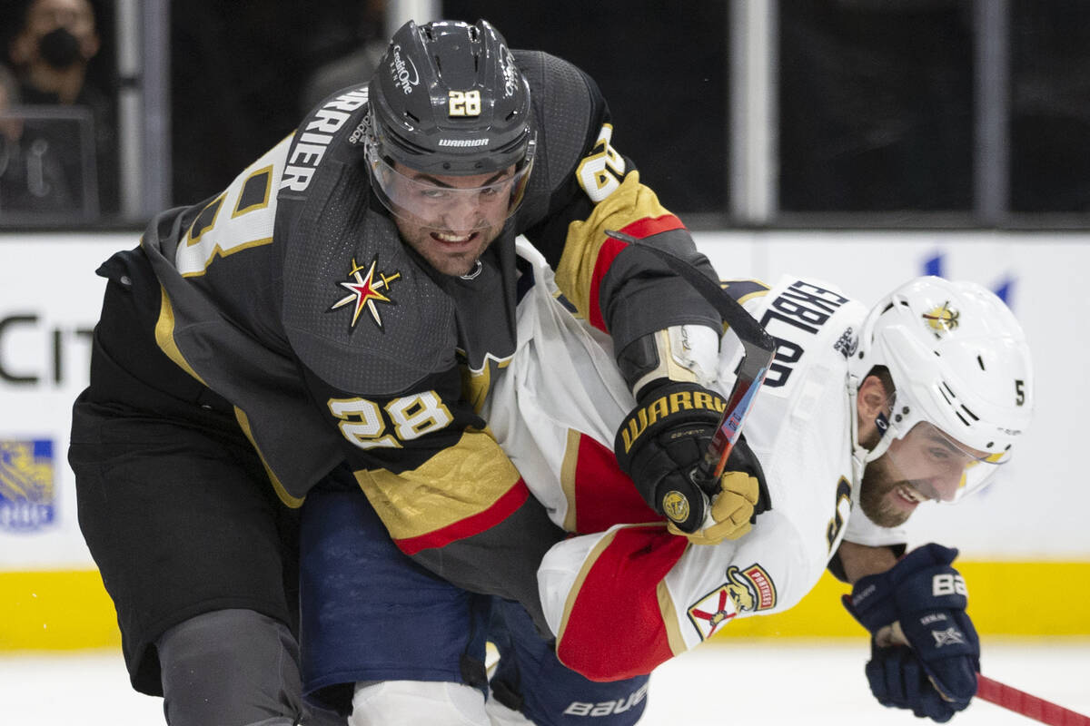 Golden Knights left wing William Carrier (28) collides with Panthers defenseman Aaron Ekblad (5 ...
