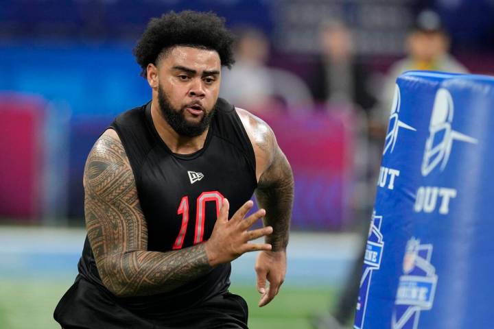 Ohio State defensive lineman Haskell Garrett runs a drill during the NFL football scouting comb ...