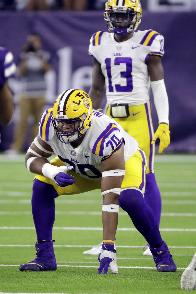 LSU guard Ed Ingram (70) in front of quarterback Jontre Kirklin (13) during the second half of ...