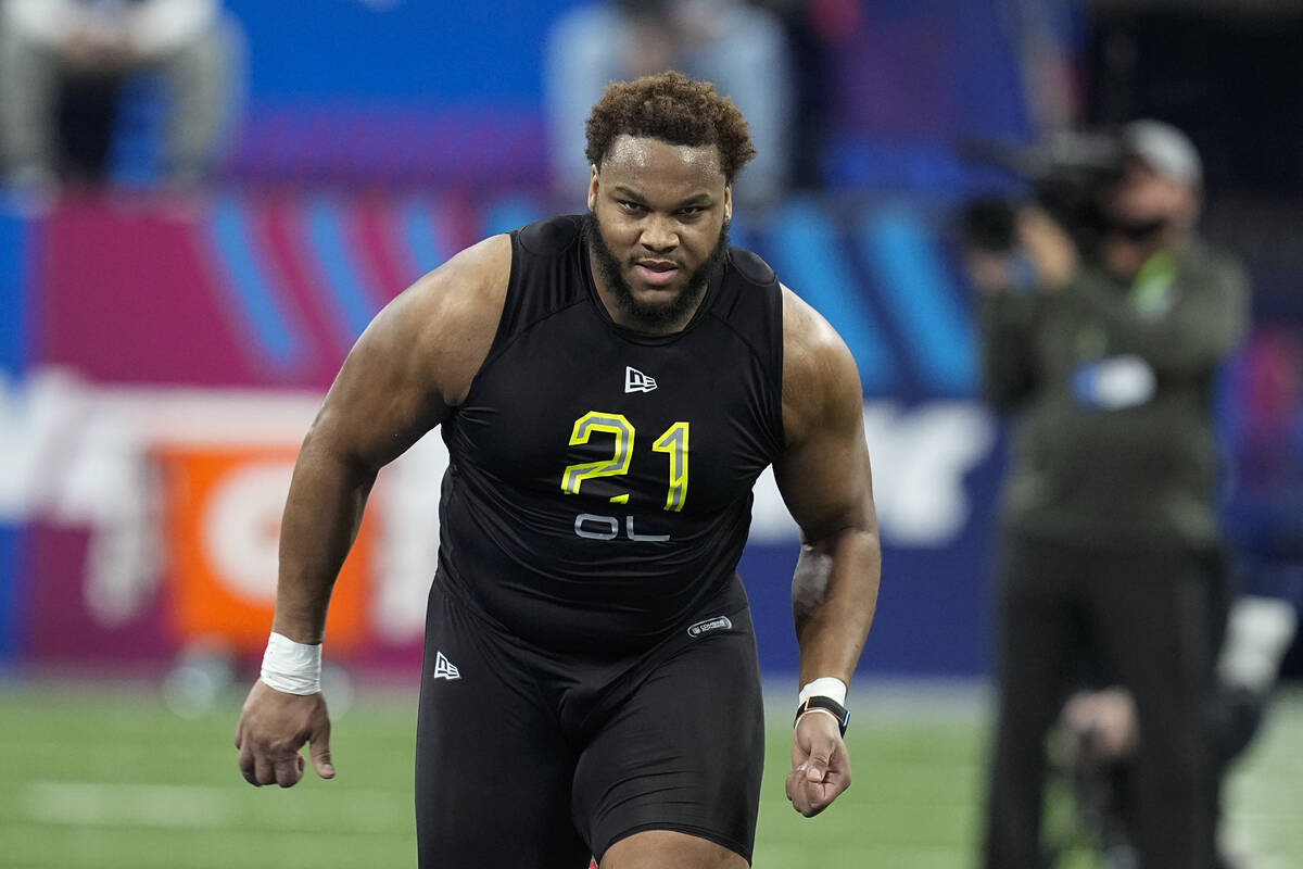 LSU offensive lineman Ed Ingram runs a drill during the NFL football scouting combine, Friday, ...