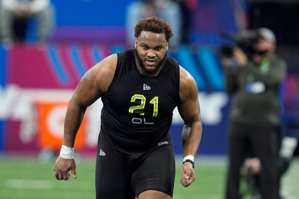 LSU offensive lineman Ed Ingram runs a drill during the NFL football scouting combine, Friday, ...