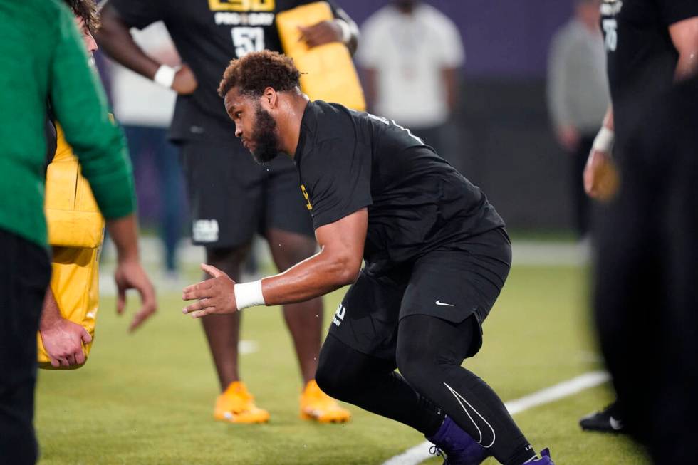 LSU guard Ed Ingram runs through drills during LSU Pro Day in Baton Rouge, La., Wednesday, Apri ...