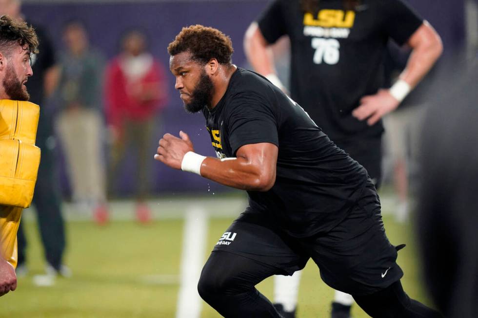 LSU guard Ed Ingram runs through drills during LSU Pro Day in Baton Rouge, La., Wednesday, Apri ...