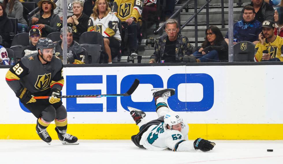San Jose Sharks defenseman Nicolas Meloche (53) gets tripped up in front of Golden Knights left ...