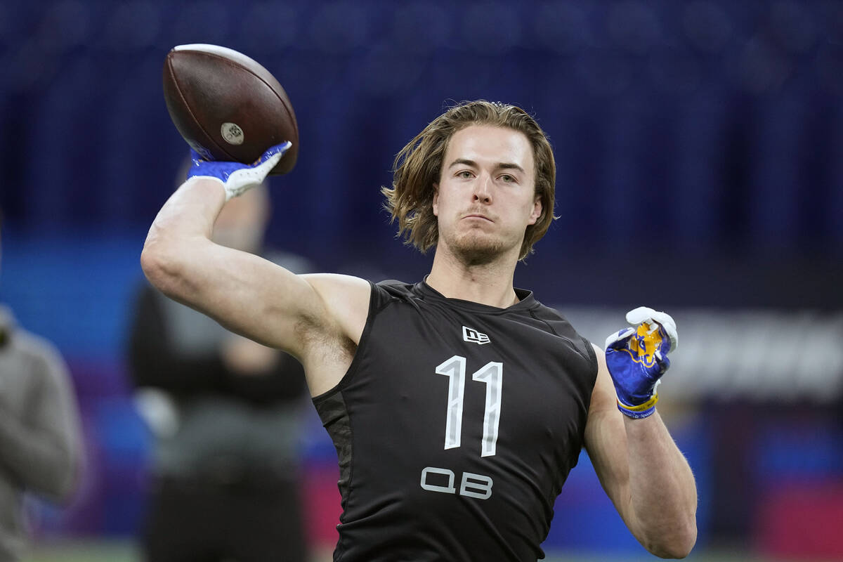 FILE - Pittsburgh quarterback Kenny Pickett throws during the NFL football scouting combine, Th ...