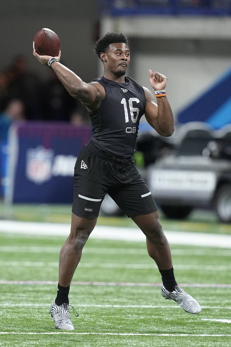 Liberty quarterback Malik Willis runs a drill during the NFL football scouting combine, Thursda ...