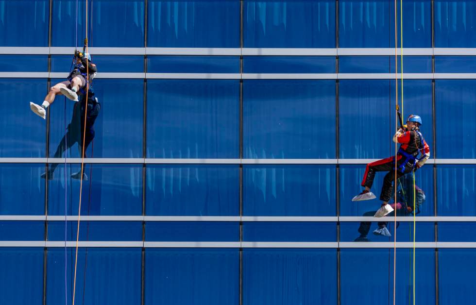 Rappellers Josh Crame with WestPac Wealth Partners, left, and Taylor Barton with the Las Vegas ...