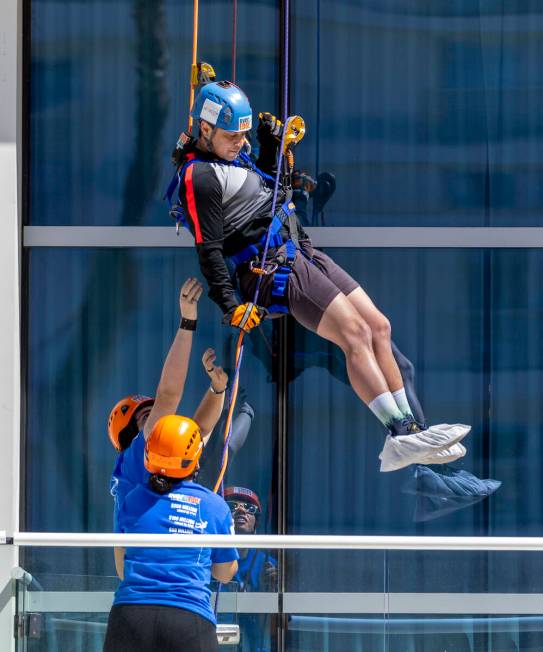 Rappeller Josh Crame with WestPac Wealth Partners nears the bottom as Over The Edge personnel a ...