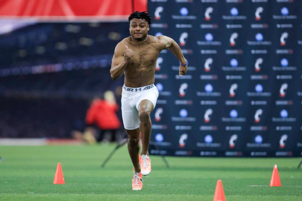 Defensive back Coby Bryant runs the 40-yard dash during Cincinnati Pro Day in Cincinnati, Thurs ...