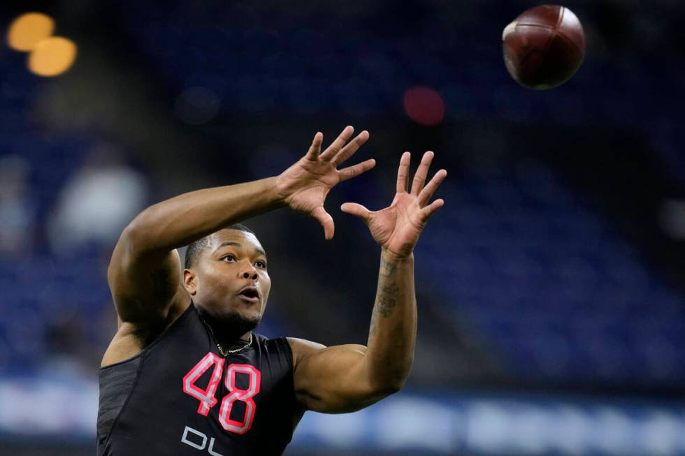 Georgia defensive lineman Travon Walker catches a pass during a drill at the NFL football scout ...