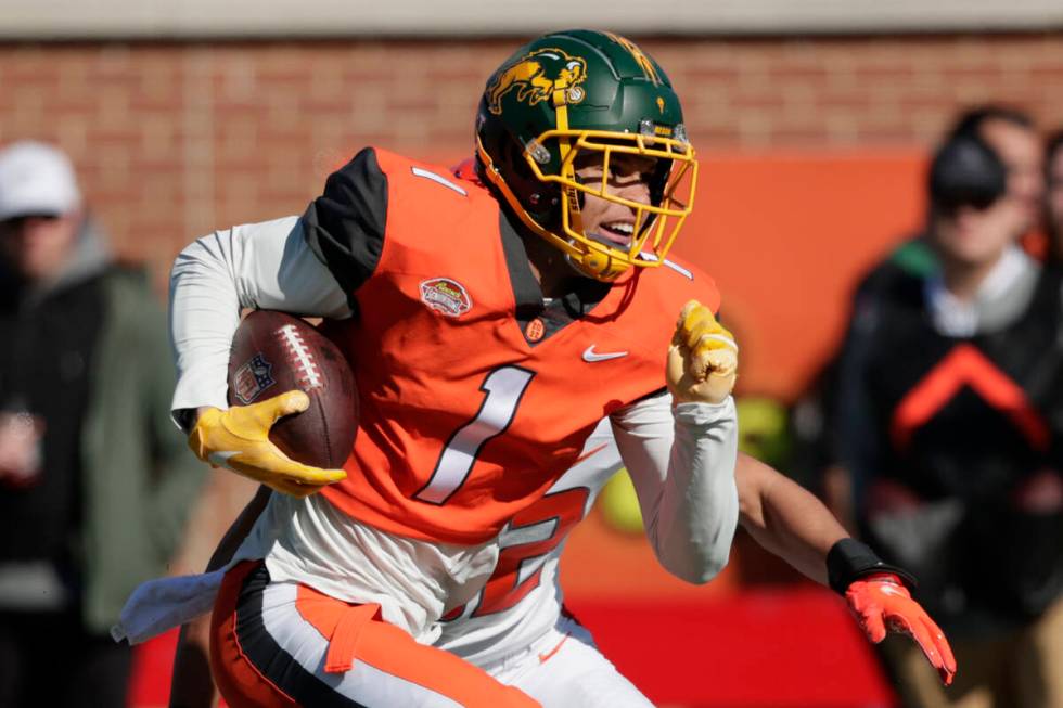 National Team wide receiver Christian Watson of North Dakota State (1) carries the ball after a ...