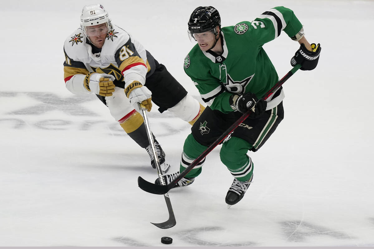 Vegas Golden Knights center Jonathan Marchessault (81) reaches for the puck in front of Dallas ...