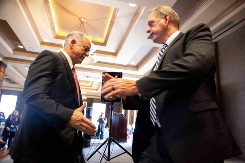 Clark county Sheriff Joe Lombardo, left, and North Las Vegas Mayor John Lee, reach for a handsh ...