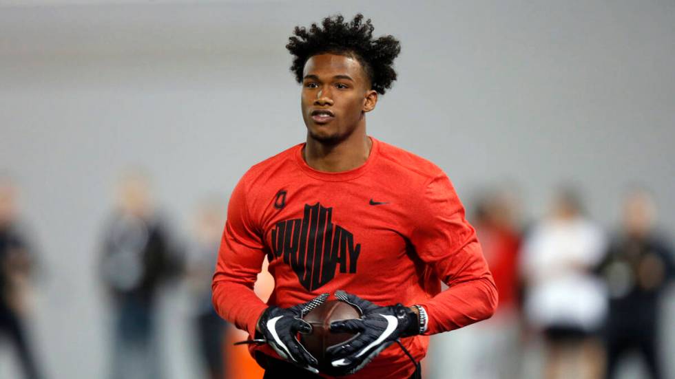 Wide receiver Garrett Wilson runs a football drill during Ohio State Pro Day in Columbus, Ohio, ...