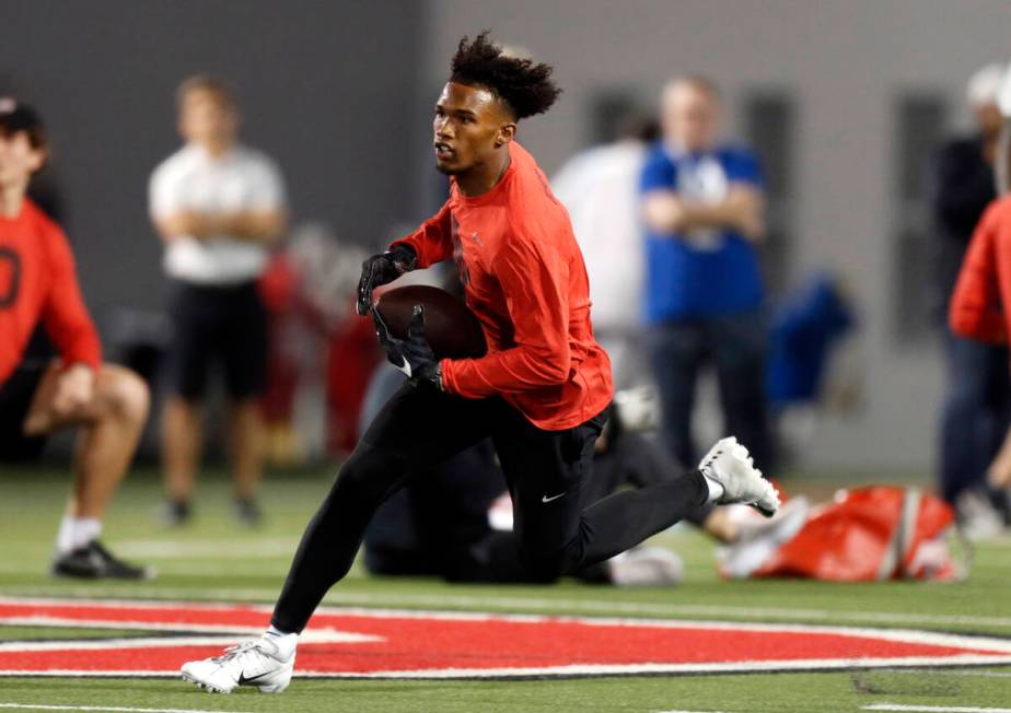 Wide receiver Garrett Wilson runs a football drill during Ohio State Pro Day in Columbus, Ohio, ...