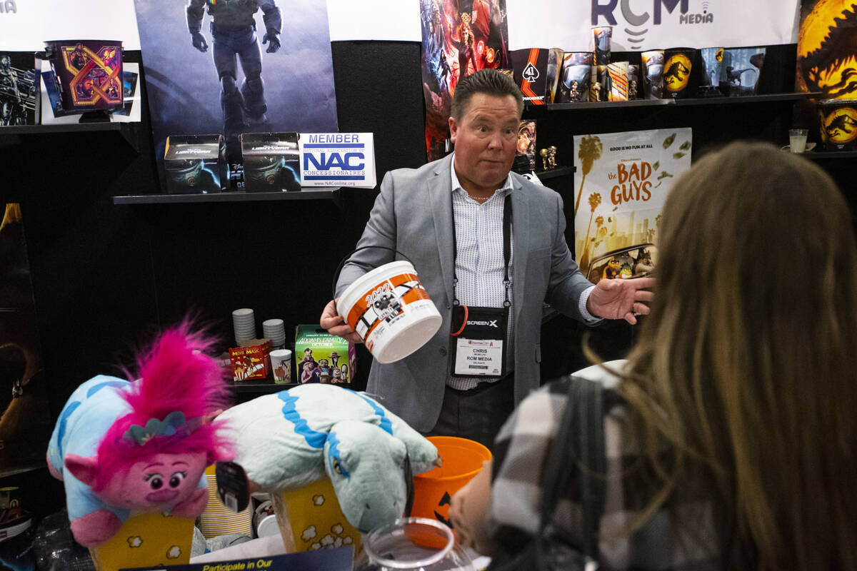 Chris McMillan of RCM Media talks with attendees at the CinemaCon trade show at Caesars Palace ...